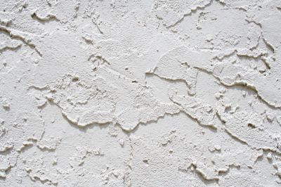 Textured drywall surface with visible imperfections, highlighting the need for professional drywall repair services in Port Charlotte, FL.