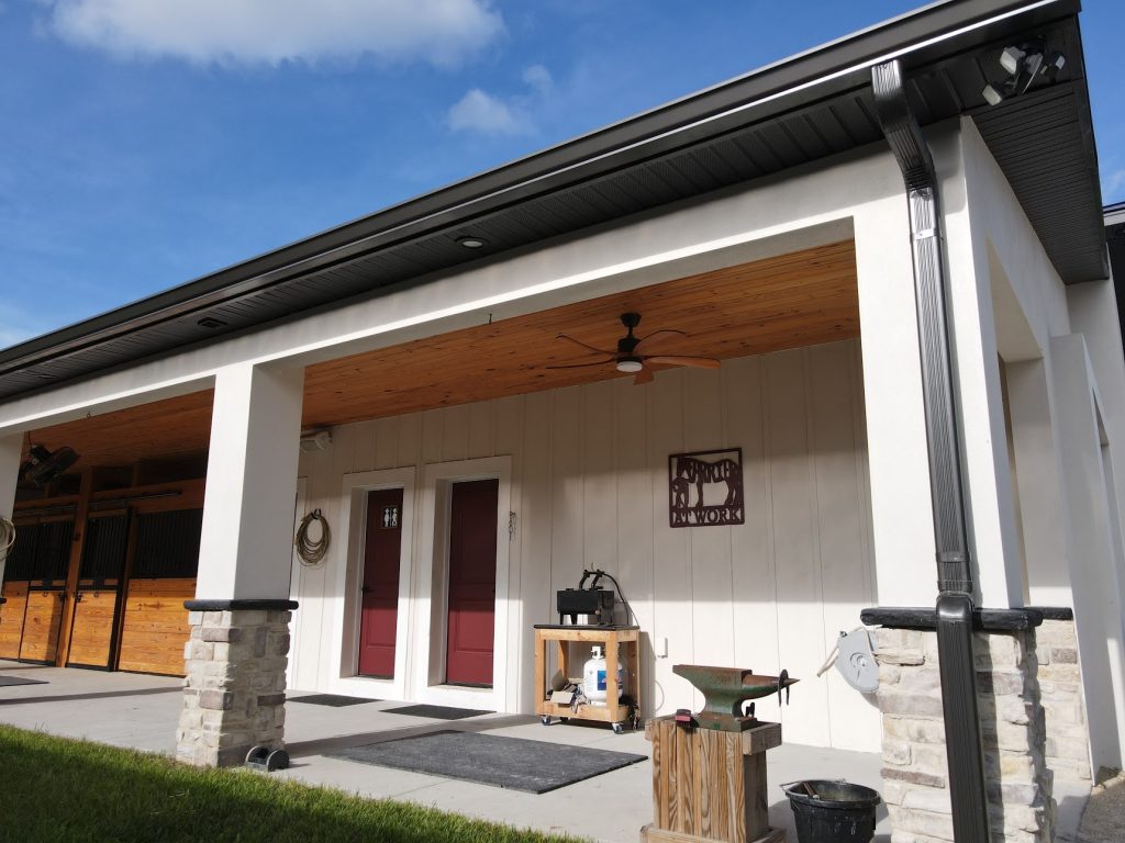 Custom metal-frame barndominium with attached garage built by Build Rite Builders in Southwest Florida