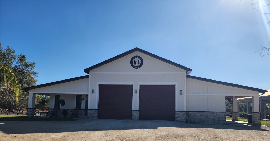 Custom metal-frame barndominium with attached garage built by Build Rite Builders in Southwest Florida