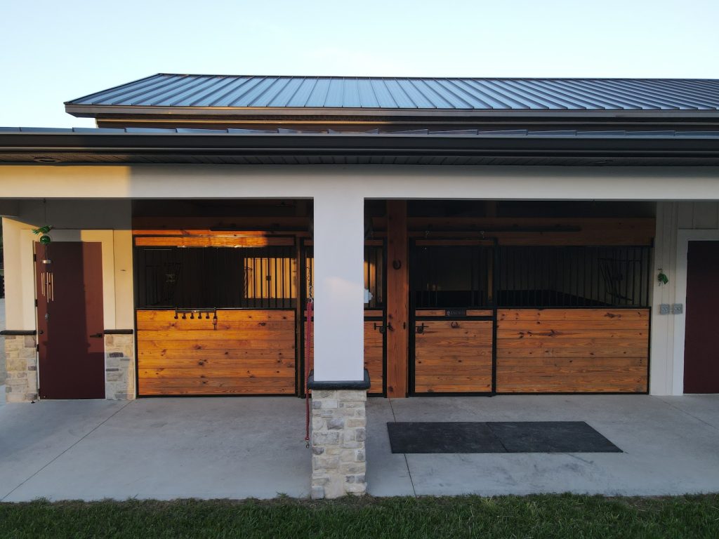 Custom metal-frame barndominium with attached garage built by Build Rite Builders in Southwest Florida