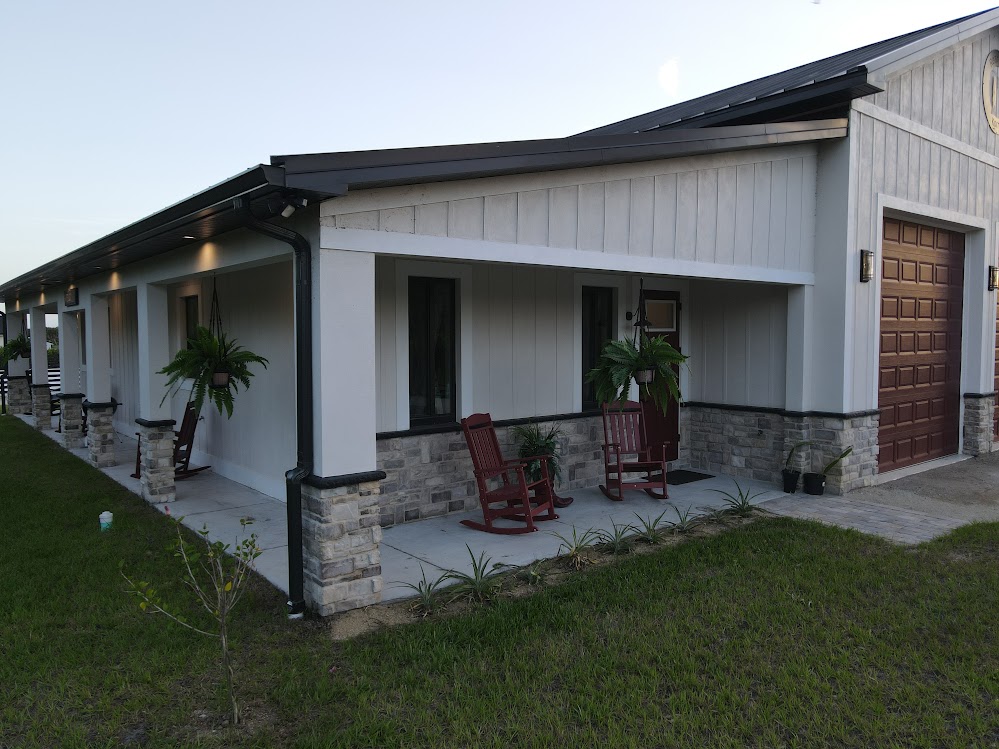 Custom barndominium with attached garage built by Build Rite Builders in Punta Gorda, FL