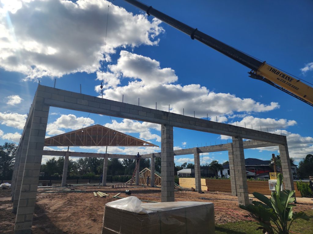 Custom outdoor living pavilion with covered seating built by Build Rite Builders in Venice, FL